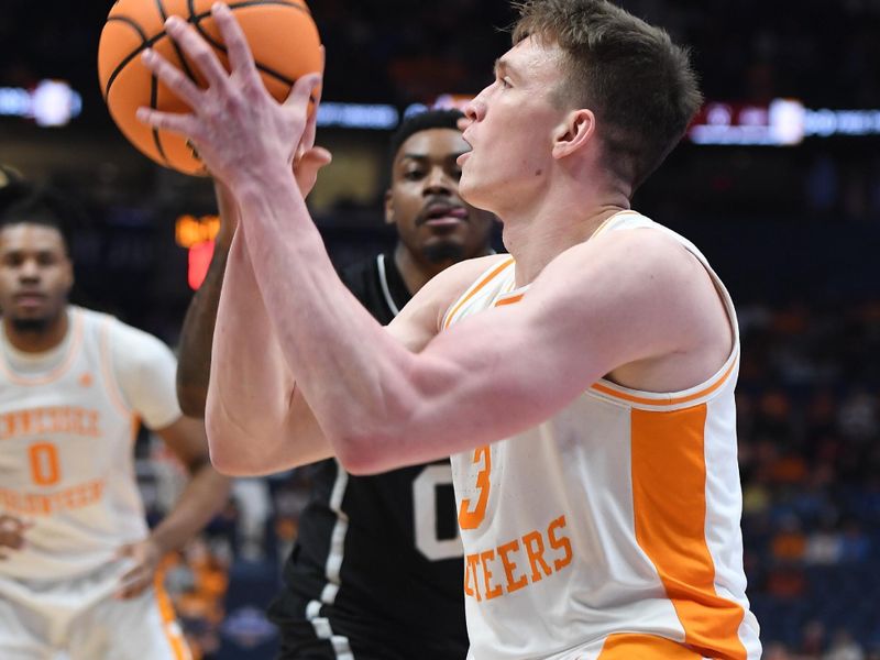 Mar 15, 2024; Nashville, TN, USA; Tennessee Volunteers guard Dalton Knecht (3) attempts a shot during the first half against the Mississippi State Bulldogs at Bridgestone Arena. Mandatory Credit: Christopher Hanewinckel-USA TODAY Sports