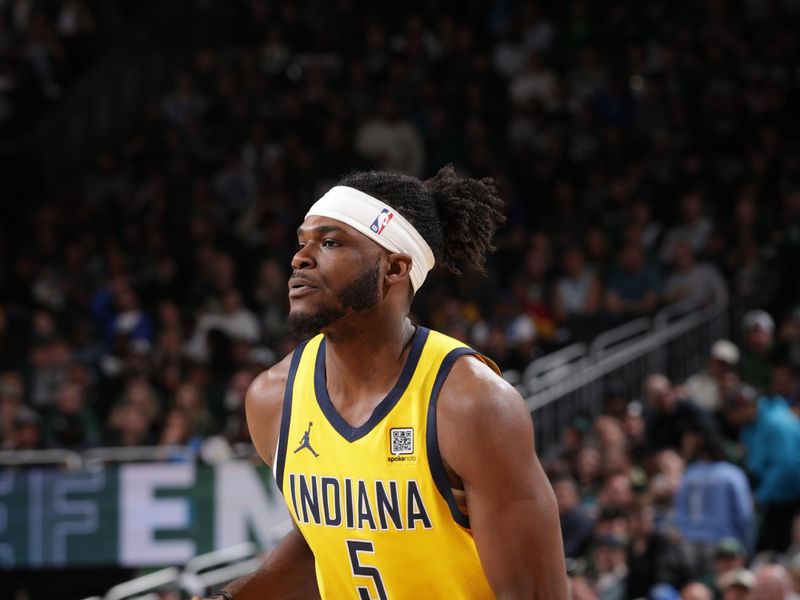 MILWAUKEE, WI - APRIL  25: Jarace Walker #5 of the Indiana Pacers shoots a three point basket during the game against the Milwaukee Bucks during Round 1 Game 3 of the 2025 NBA Playoffs on April 25, 2025 at Fiserv Forum Center in Milwaukee, Wisconsin. NOTE TO USER: User expressly acknowledges and agrees that, by downloading and or using this Photograph, user is consenting to the terms and conditions of the Getty Images License Agreement. Mandatory Copyright Notice: Copyright 2025 NBAE (Photo by Gary Dineen/NBAE via Getty Images).