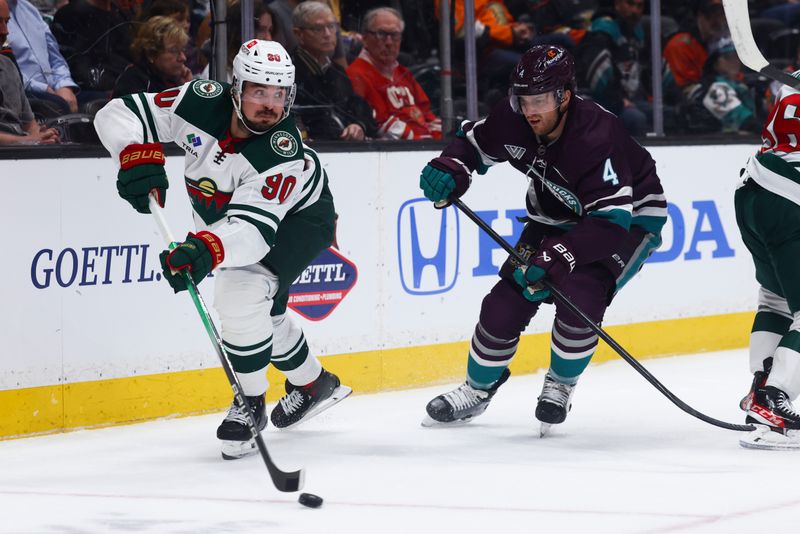 Mar 19, 2024; Anaheim, California, USA; Minnesota Wild center Marcus Johansson (90) skates with the puck against the Anaheim Ducks during the first period of a game at Honda Center. Mandatory Credit: Jessica Alcheh-USA TODAY Sports