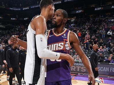 PHOENIX, AZ - NOVEMBER 2: Victor Wembanyama #1 of the San Antonio Spurs and Kevin Durant #35 of the Phoenix Suns talk after the game on November 2, 2023 at Footprint Center in Phoenix, Arizona. NOTE TO USER: User expressly acknowledges and agrees that, by downloading and or using this photograph, user is consenting to the terms and conditions of the Getty Images License Agreement. Mandatory Copyright Notice: Copyright 2023 NBAE (Photo by Garrett Ellwood/NBAE via Getty Images)