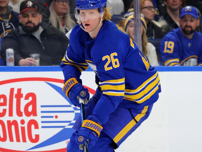 Dec 30, 2023; Buffalo, New York, USA;  Buffalo Sabres defenseman Rasmus Dahlin (26) controls the puck during the first period against the Columbus Blue Jackets at KeyBank Center. Mandatory Credit: Timothy T. Ludwig-USA TODAY Sports