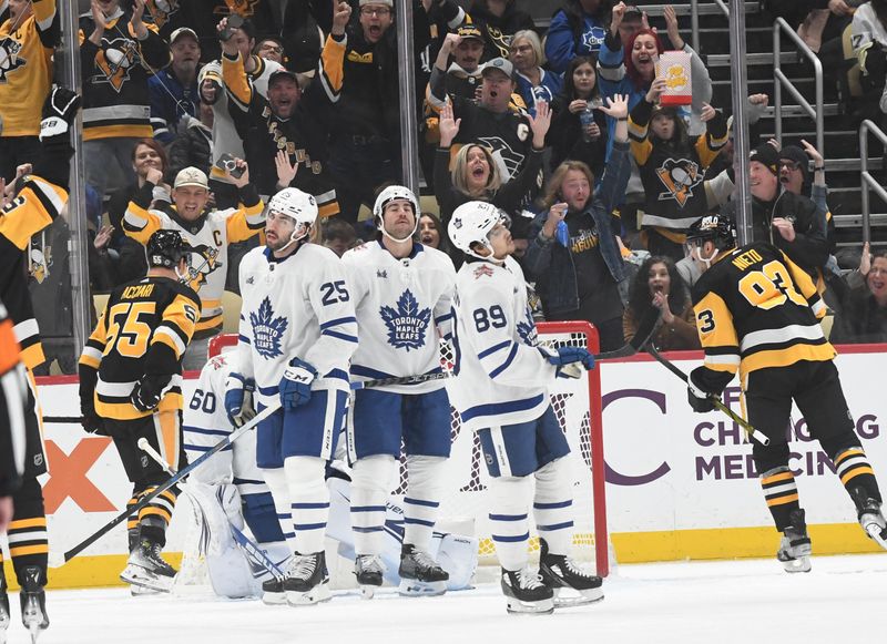 Nov 25, 2023; Pittsburgh, Pennsylvania, USA; Pittsburgh Penguins left wing Matt Nieto (83) and center Noel Acciari (55) celebrate a goal against the Toronto Maple Leafs  during the second period at PPG Paints Arena. Mandatory Credit: Philip G. Pavely-USA TODAY Sports