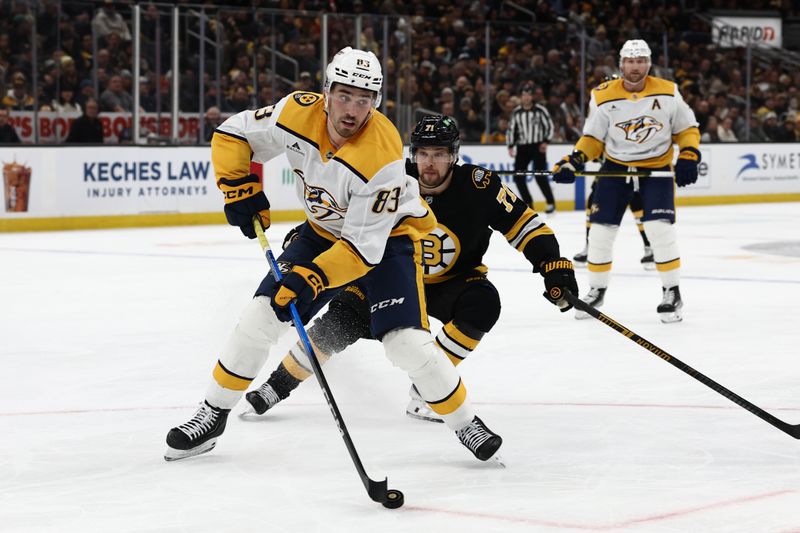 Jan 27, 2026; Boston, Massachusetts, USA; Nashville Predators defenseman Adam Wilsby (83) looks to get away from Boston Bruins left wing Viktor Arvidsson (71) during the first period at TD Garden. Mandatory Credit: Winslow Townson-Imagn Images