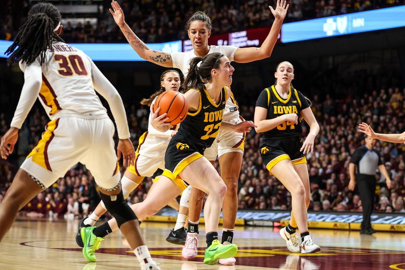 Feb 28, 2024; Minneapolis, Minnesota, USA; Iowa Hawkeyes guard Caitlin Clark (22) works towards the basket as Minnesota Golden Gophers forward Ayianna Johnson (1) defends during the second half at Williams Arena. Mandatory Credit: Matt Krohn-USA TODAY Sports