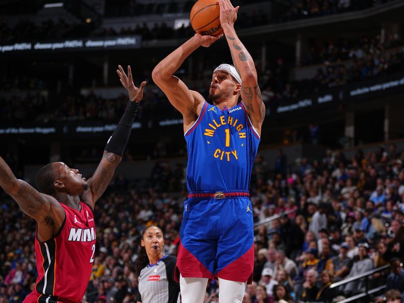 DENVER, CO - NOVEMBER 8: Michael Porter Jr. #1 of the Denver Nuggets shoots a three point basket during the game against the Miami Heat on November 8, 2024 at Ball Arena in Denver, Colorado. NOTE TO USER: User expressly acknowledges and agrees that, by downloading and/or using this Photograph, user is consenting to the terms and conditions of the Getty Images License Agreement. Mandatory Copyright Notice: Copyright 2024 NBAE (Photo by Garrett Ellwood/NBAE via Getty Images)