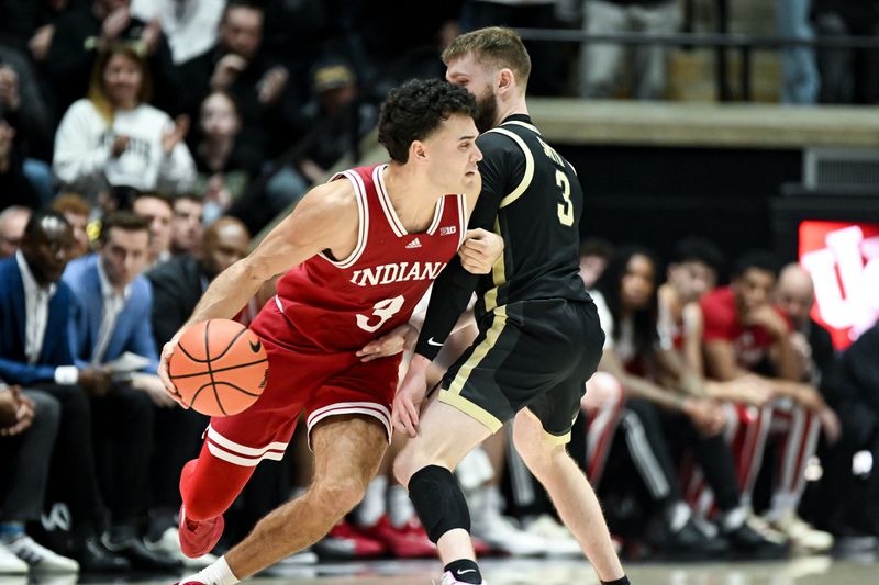 Jan 31, 2025; West Lafayette, Indiana, USA; Indiana Hoosiers guard Anthony Leal (3) commits an offensive foul against Purdue Boilermakers guard Braden Smith (3) during the second half at Mackey Arena. Mandatory Credit: Robert Goddin-Imagn Images