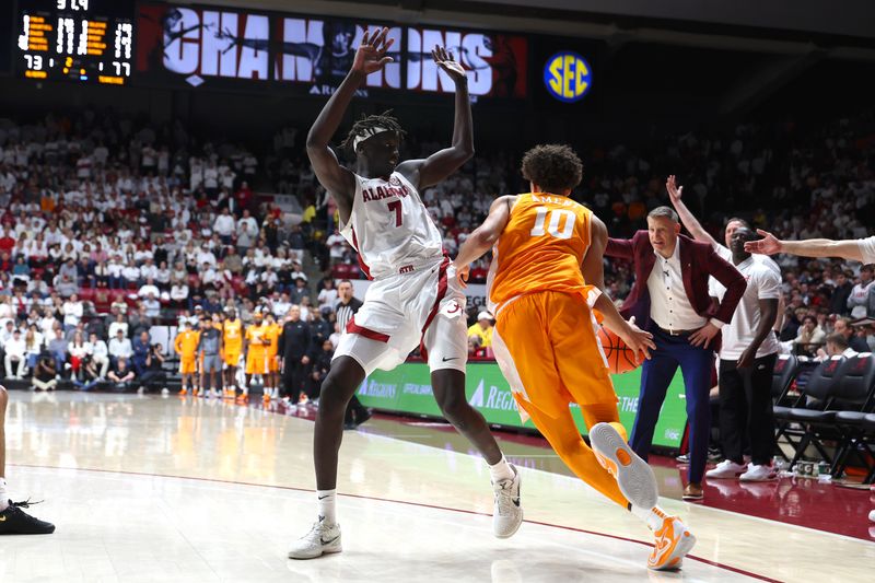 Jan 24, 2026; Tuscaloosa, Alabama, USA; Tennessee Volunteers forward Nate Ament (10) dribbles against Alabama Crimson Tide forward Taylor Bol Bowen (7) during the second half at Coleman Coliseum. Mandatory Credit: David Leong-Imagn Images
