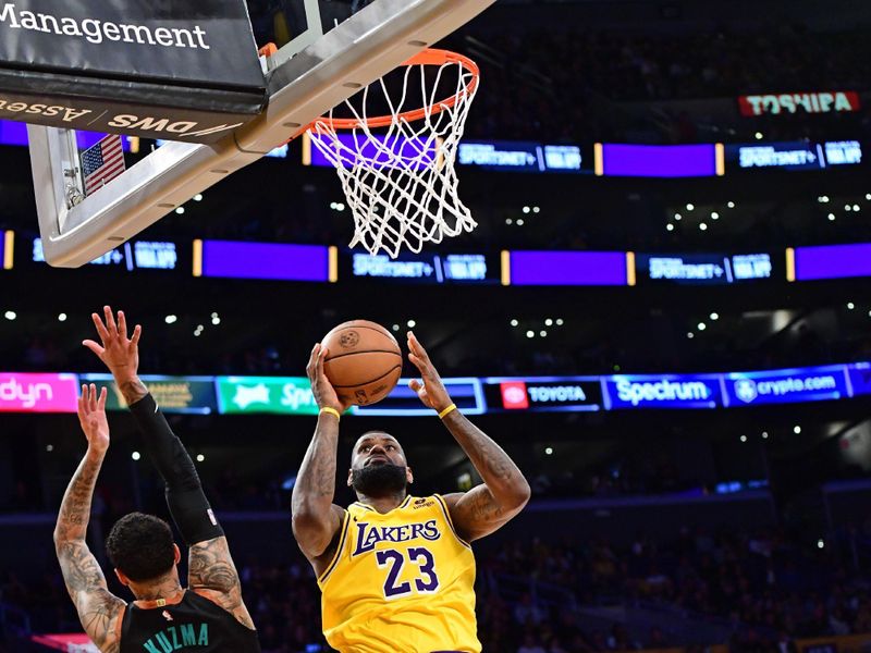 LOS ANGELES, CA - FEBRUARY 29: LeBron James #23 of the Los Angeles Lakers drives to the basket during the game against the Washington Wizards on February 29, 2024 at Crypto.Com Arena in Los Angeles, California. NOTE TO USER: User expressly acknowledges and agrees that, by downloading and/or using this Photograph, user is consenting to the terms and conditions of the Getty Images License Agreement. Mandatory Copyright Notice: Copyright 2024 NBAE (Photo by Adam Pantozzi/NBAE via Getty Images)