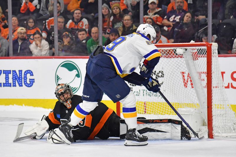 Mar 4, 2024; Philadelphia, Pennsylvania, USA; St. Louis Blues left wing Pavel Buchnevich (89) scores the game-winning goal in the shootout against Philadelphia Flyers goaltender Samuel Ersson (33) Wells Fargo Center. Mandatory Credit: Eric Hartline-USA TODAY Sports