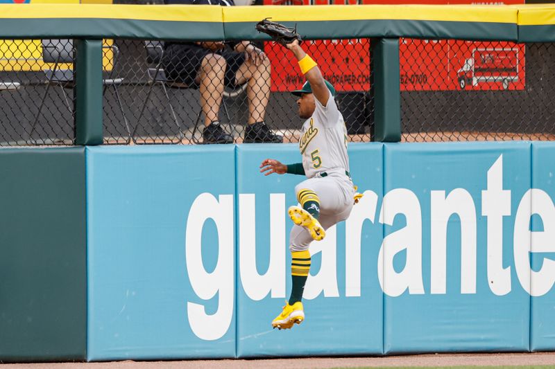 Aug 25, 2023; Chicago, Illinois, USA; Oakland Athletics second baseman Tony Kemp (5) catches a fly ball hit by Chicago White Sox third baseman Yoan Moncada during the second inning at Guaranteed Rate Field. Mandatory Credit: Kamil Krzaczynski-USA TODAY Sports