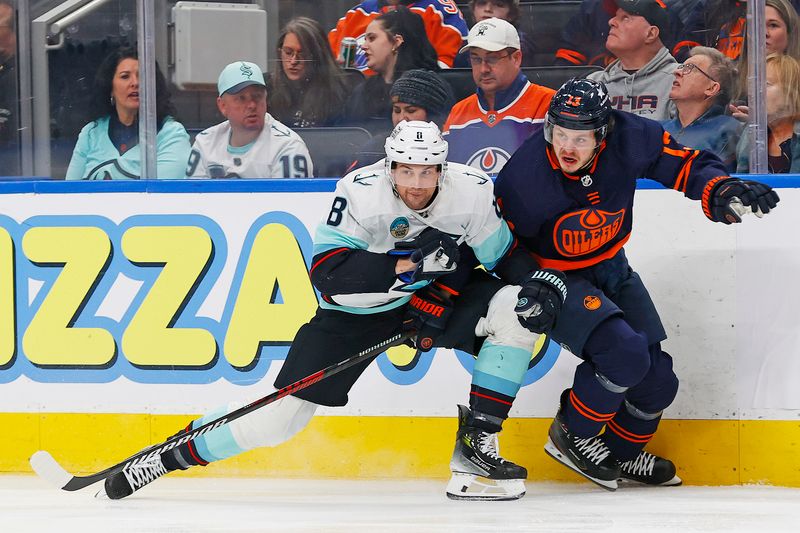 Jan 18, 2024; Edmonton, Alberta, CAN; Seattle Kraken defensemen Brian Dumoulin (8) and Edmonton Oilers forward Mattias Janmark (13) battler for position during the third period at Rogers Place. Mandatory Credit: Perry Nelson-USA TODAY Sports