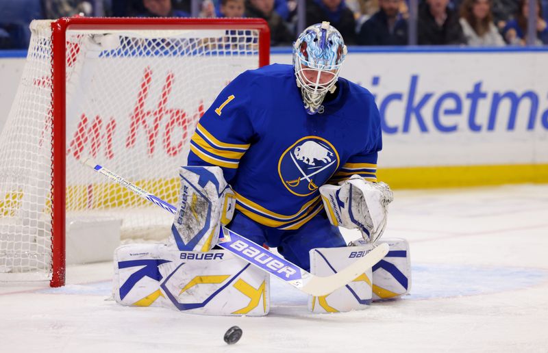 Jan 15, 2025; Buffalo, New York, USA;  Buffalo Sabres goaltender Ukko-Pekka Luukkonen (1) looks to make a save during the first period against the Carolina Hurricanes at KeyBank Center. Mandatory Credit: Timothy T. Ludwig-Imagn Images