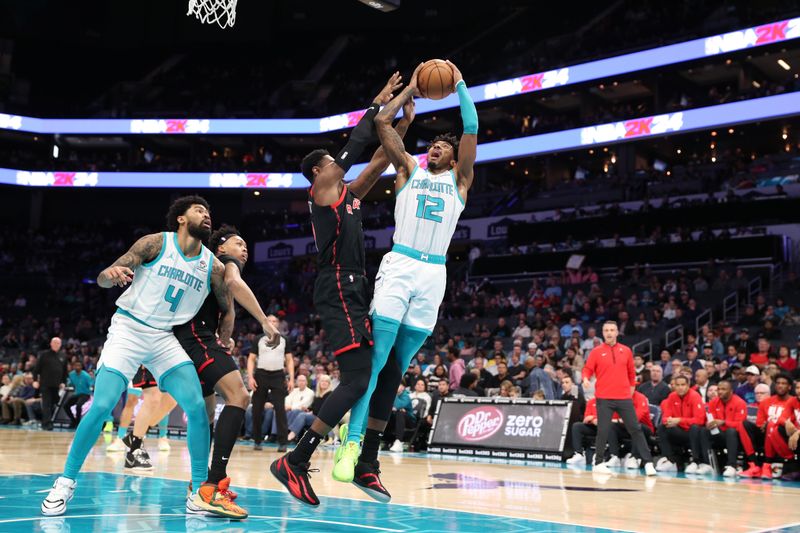 CHARLOTTE, NC - FEBRUARY 7:  Leaky Black #12 of the Charlotte Hornets drives to the basket during the game against the Toronto Raptors on February 7, 2024 at Spectrum Center in Charlotte, North Carolina. NOTE TO USER: User expressly acknowledges and agrees that, by downloading and or using this photograph, User is consenting to the terms and conditions of the Getty Images License Agreement.  Mandatory Copyright Notice:  Copyright 2024 NBAE (Photo by Brock Williams-Smith/NBAE via Getty Images)