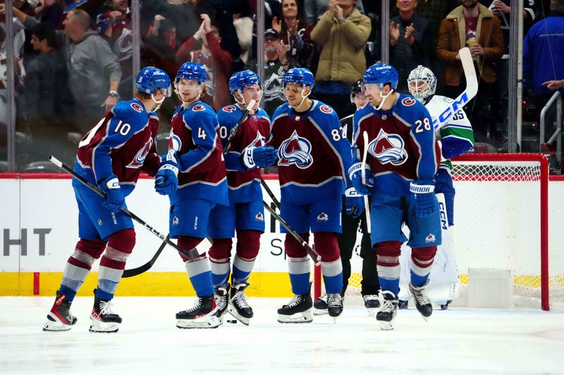 Nov 22, 2023; Denver, Colorado, USA; Colorado Avalanche forward Riley Tufte (10) celebrates his goal with teammates in the third period against the Colorado Avalanche at Ball Arena. Mandatory Credit: Ron Chenoy-USA TODAY Sports