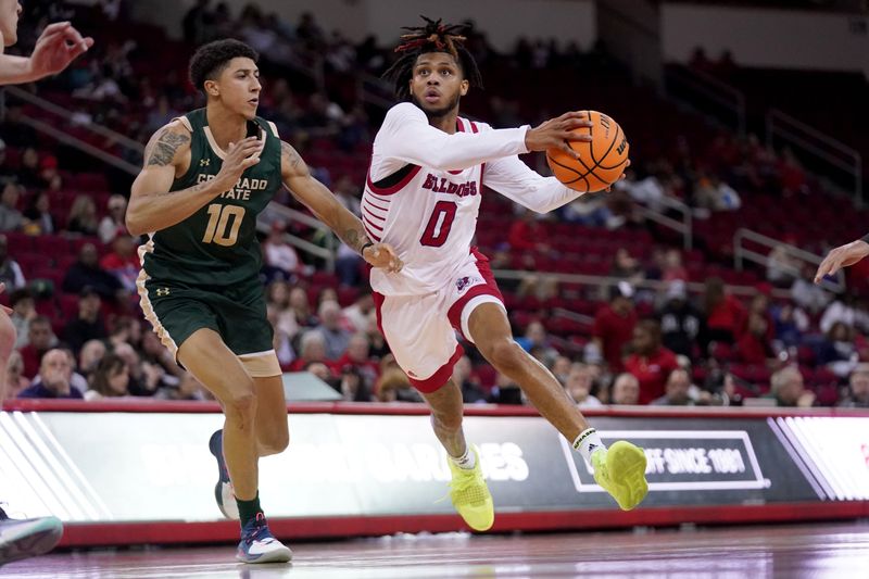 Feb 3, 2024; Fresno, California, USA; Fresno State Bulldogs Donavan Yap Jr. (0) drives past Colorado State Rams guard Nique Clifford (10) in the second half at the Save Mart Center. Mandatory Credit: Cary Edmondson-USA TODAY Sports