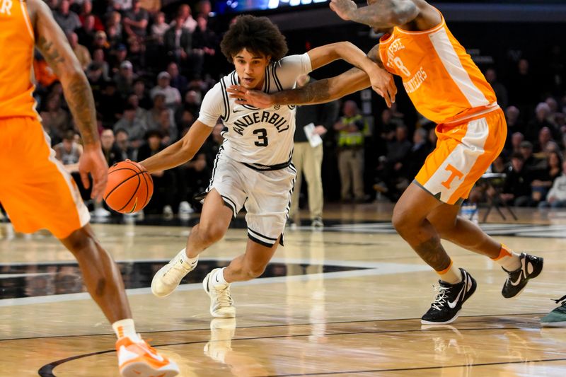 Jan 18, 2025; Nashville, Tennessee, USA;  Vanderbilt Commodores guard Tyler Tanner (3) drives past Tennessee Volunteers guard Darlinstone Dubar (8) during the first half at Memorial Gymnasium. Mandatory Credit: Steve Roberts-Imagn Images