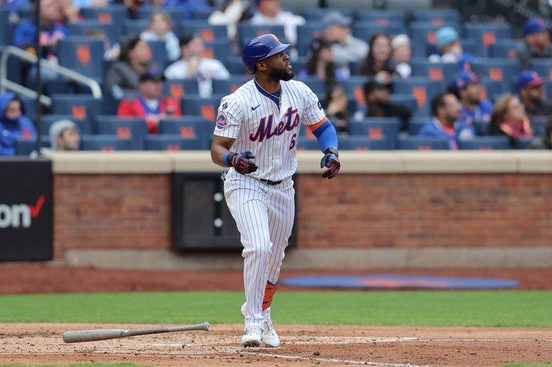 Apr 17, 2024; New York City, New York, USA; New York Mets designated hitter Starling Marte (6) watches his two run home run against the Pittsburgh Pirates during the third inning at Citi Field. Mandatory Credit: Brad Penner-USA TODAY Sports