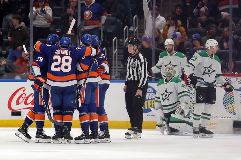 Jan 21, 2024; Elmont, New York, USA; New York Islanders right wing Hudson Fasching (20) celebrates his goal against Dallas Stars goaltender Scott Wedgewood (41) with teammates during the third period at UBS Arena. Mandatory Credit: Brad Penner-USA TODAY Sports