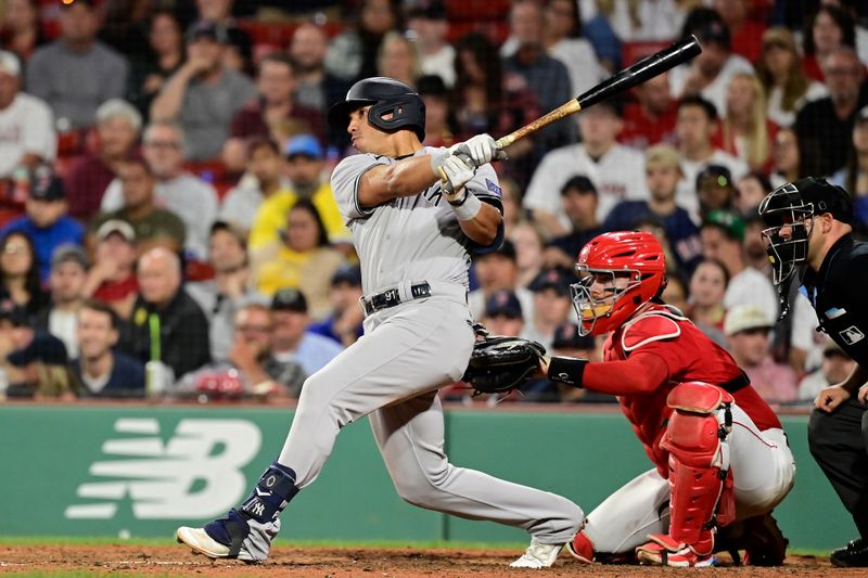 Sep 14, 2023; Boston, Massachusetts, USA; New York Yankees third baseman Oswald Peraza (91) hits a two run home run against the Boston Red Sox during the ninth inning at Fenway Park. Mandatory Credit: Eric Canha-USA TODAY Sports