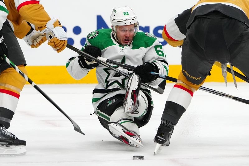 Apr 29, 2024; Las Vegas, Nevada, USA; Dallas Stars right wing Evgenii Dadonov (63) is tripped up between Vegas Golden Knights defenseman Alec Martinez (23) and Vegas Golden Knights center Jack Eichel (9) during the second period of game four of the first round of the 2024 Stanley Cup Playoffs at T-Mobile Arena. Mandatory Credit: Stephen R. Sylvanie-USA TODAY Sports