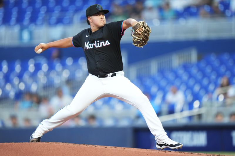 May 2, 2025; Miami, Florida, USA;  Miami Marlins pitcher Valente Bellozo (83) pitches against the Oakland Athletics in the second inning at loanDepot Park. Mandatory Credit: Jim Rassol-Imagn Images