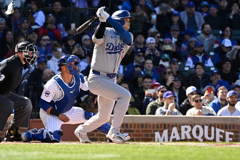 Apr 6, 2024; Chicago, Illinois, USA;  Los Angeles Dodgers two-way player Shohei Ohtani (17) singles against the Chicago Cubs during the first inning at Wrigley Field. Mandatory Credit: Matt Marton-USA TODAY Sports