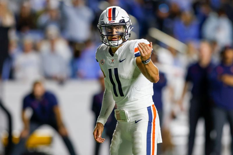 Oct 21, 2023; Chapel Hill, North Carolina, USA; Virginia Cavaliers quarterback Tony Muskett (11) calls a play against the North Carolina Tar Heels in the second half at Kenan Memorial Stadium. Mandatory Credit: Nell Redmond-USA TODAY Sports