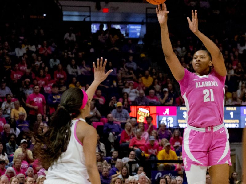 Feb 11, 2024; Baton Rouge, Louisiana, USA;  Alabama Crimson Tide forward Essence Cody (21) shoots over LSU Lady Tigers forward Angel Reese (10) during the second half at Pete Maravich Assembly Center. Mandatory Credit: Matthew Hinton-USA TODAY Sports