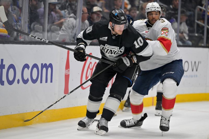 Nov 6, 2025; Los Angeles, California, USA; Los Angeles Kings right wing Corey Perry (10) and Florida Panthers defenseman Seth Jones (3) fight for position on the ice during the second period at Crypto.com Arena. Mandatory Credit: Jayne Kamin-Oncea-Imagn Images