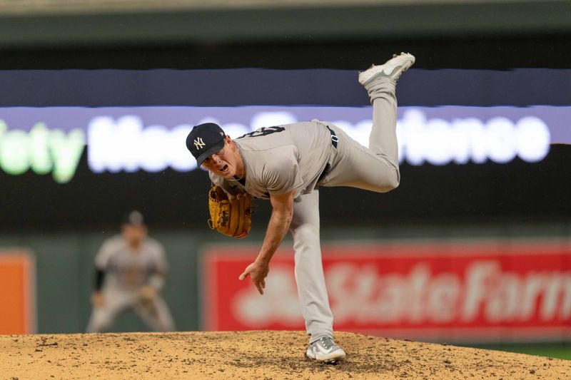 May 15, 2024; Minneapolis, Minnesota, USA; New York Yankees pitcher Caleb Ferguson (64) pitches in the ninth inning against the Minnesota Twins at Target Field. Mandatory Credit: Matt Blewett-USA TODAY Sports