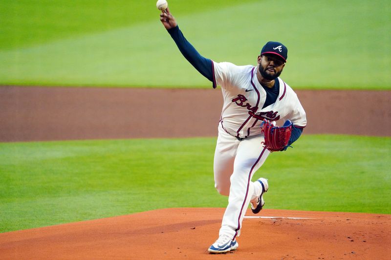 May 13, 2024; Cumberland, Georgia, USA; Atlanta Braves pitcher Reynaldo Lopez (40) fires a pitch against the Chicago Cubs during the first inning at Truist Park. Mandatory Credit: John David Mercer-USA TODAY Sports