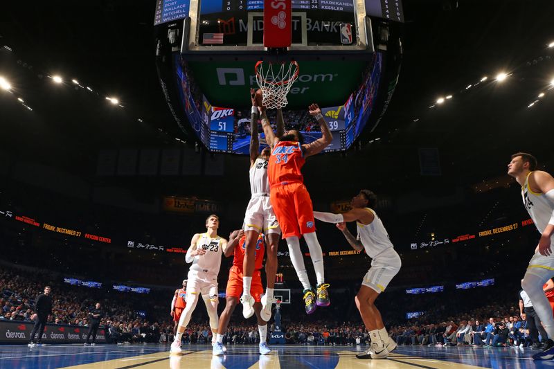 OKLAHOMA CITY, OK - DECEMBER 3: Kenrich Williams #34 of the Oklahoma City Thunder and Collin Sexton #2 of the Utah Jazz goes up for the rebound during the game during the Emirates NBA Cup game on on December 3, 2024 at Paycom Center in Oklahoma City, Oklahoma. NOTE TO USER: User expressly acknowledges and agrees that, by downloading and or using this photograph, User is consenting to the terms and conditions of the Getty Images License Agreement. Mandatory Copyright Notice: Copyright 2024 NBAE (Photo by Zach Beeker/NBAE via Getty Images)