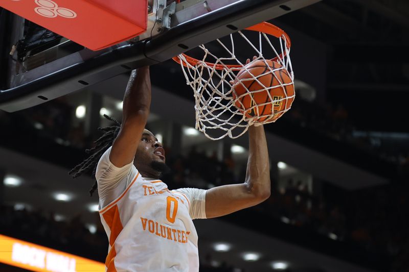 Mar 9, 2024; Knoxville, Tennessee, USA; Tennessee Volunteers forward Jonas Aidoo (0) dunks the ball against the Kentucky Wildcats during the second half at Thompson-Boling Arena at Food City Center. Mandatory Credit: Randy Sartin-USA TODAY Sports