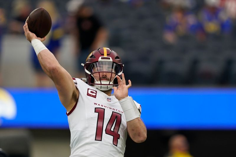 Washington Commanders quarterback Sam Howell (14) warms up before an NFL football game against the Los Angeles Rams Sunday, Dec. 17, 2023, in Los Angeles. (AP Photo/Ryan Sun)