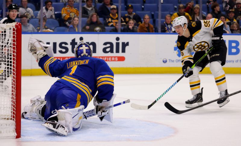 Jan 28, 2025; Buffalo, New York, USA;  Buffalo Sabres goaltender Ukko-Pekka Luukkonen (1) makes a glove save on Boston Bruins center Vinni Lettieri (95) during the third period at KeyBank Center. Mandatory Credit: Timothy T. Ludwig-Imagn Images