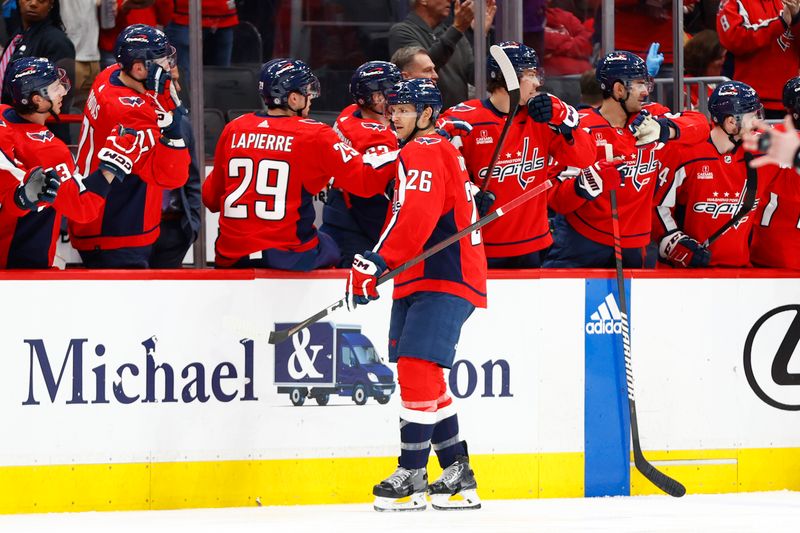 Mar 26, 2024; Washington, District of Columbia, USA; Washington Capitals right wing Nic Dowd (26) celebrates with teammates on the bench after scoring a goal against the Detroit Red Wings during the second period at Capital One Arena. Mandatory Credit: Amber Searls-USA TODAY Sports