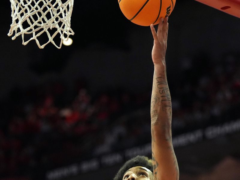 Jan 28, 2023; Madison, Wisconsin, USA;  Wisconsin Badgers guard Chucky Hepburn (23) scores during the second half against the Illinois Fighting Illini at the Kohl Center. Mandatory Credit: Kayla Wolf-USA TODAY Sports