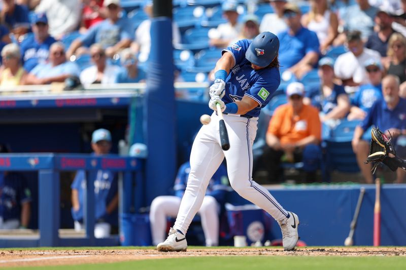 Mar 8, 2026; Dunedin, Florida, USA; Toronto Blue Jays third baseman Addison Barger (47) hits a solo home run against the Detroit Tigers in the second inning during spring training at TD Ballpark. Mandatory Credit: Nathan Ray Seebeck-Imagn Images
