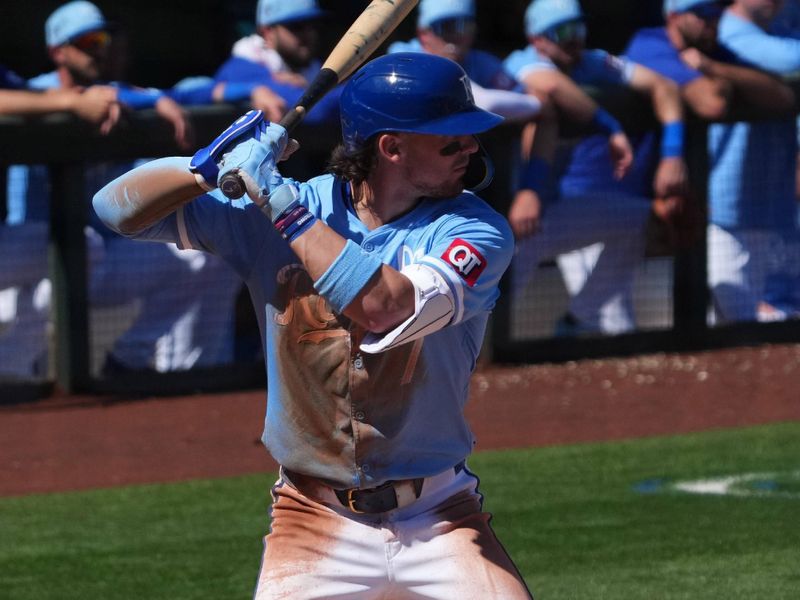 Mar 11, 2024; Surprise, Arizona, USA; Kansas City Royals shortstop Bobby Witt Jr. (7) bats against the San Francisco Giants during the second inning at Surprise Stadium. Mandatory Credit: Joe Camporeale-USA TODAY Sports