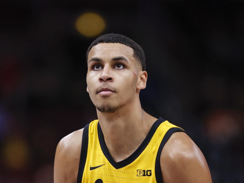 Mar 9, 2023; Chicago, IL, USA; Iowa Hawkeyes forward Kris Murray (24) shoots a free throw against the Ohio State Buckeyes during the second half at United Center. Mandatory Credit: Kamil Krzaczynski-USA TODAY Sports