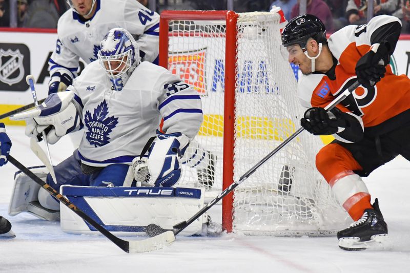 Mar 14, 2024; Philadelphia, Pennsylvania, USA; Toronto Maple Leafs goaltender Ilya Samsonov (35) makes a save against Philadelphia Flyers right wing Garnet Hathaway (19) during the third period at Wells Fargo Center. Mandatory Credit: Eric Hartline-USA TODAY Sports