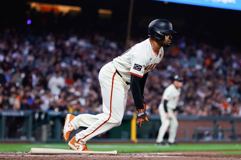 Aug 19, 2024; San Francisco, California, USA; San Francisco Giants first base LaMonte Wade Jr. (31) hits an RBI single during the fifth inning against the Chicago White Sox at Oracle Park. Mandatory Credit: Sergio Estrada-USA TODAY Sports