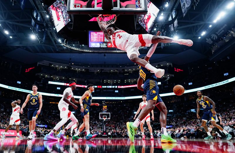 TORONTO, ON - NOVEMBER 18: Jonathan Mogbo #2 of the Toronto Raptors dunks against the Indiana Pacers during the first half at the Scotiabank Arena on November 18, 2024 in Toronto, Ontario, Canada. NOTE TO USER: User expressly acknowledges and agrees that, by downloading and/or using this Photograph, user is consenting to the terms and conditions of the Getty Images License Agreement. (Photo by Mark Blinch/Getty Images)