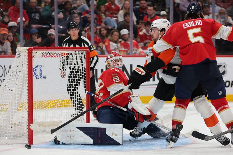 Oct 9, 2025; Sunrise, Florida, USA; Florida Panthers goaltender Sergei Bobrovsky (72) males a save against Philadelphia Flyers left wing Noah Cates (27) during the third period at Amerant Bank Arena. Mandatory Credit: Sam Navarro-Imagn Images
