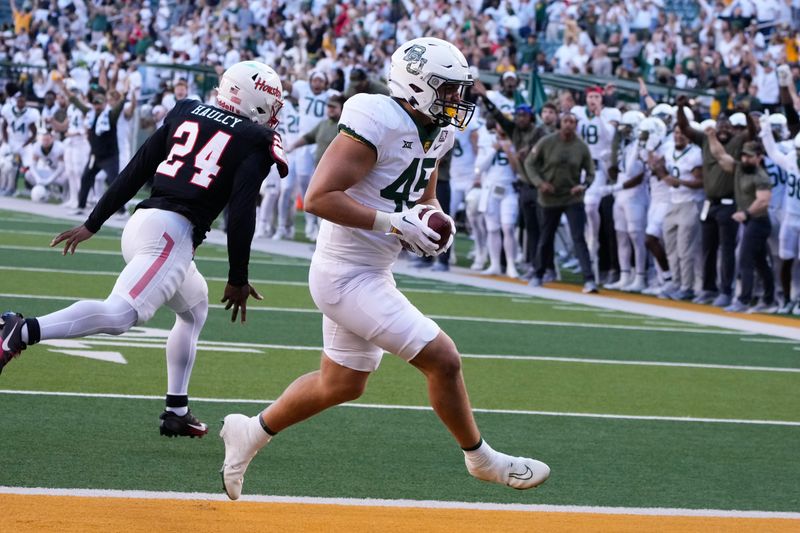 Nov 4, 2023; Waco, Texas, USA;  Baylor Bears tight end Hawkins Polley (45) makes a touchdown catch against Houston Cougars defensive back Adari Haulcy (24) during the second half at McLane Stadium. Mandatory Credit: Chris Jones-USA TODAY Sports