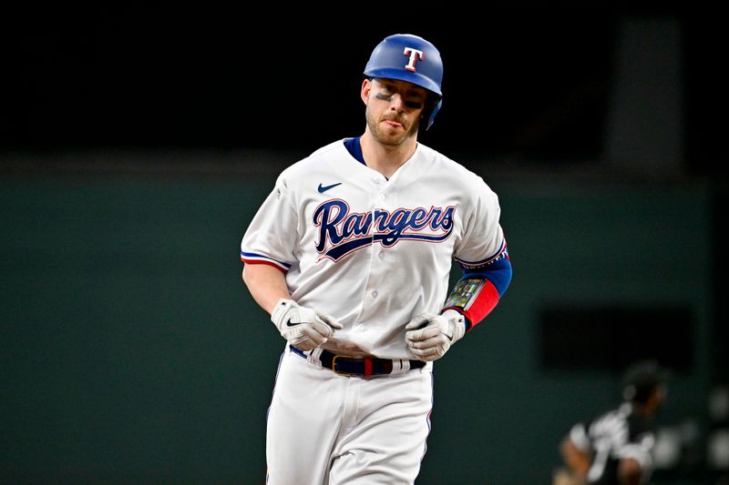 Aug 3, 2023; Arlington, Texas, USA; Texas Rangers catcher Mitch Garver (18) rounds the bases after he hits a home run against the Chicago White Sox during the fourth inning at Globe Life Field. Mandatory Credit: Jerome Miron-USA TODAY Sports