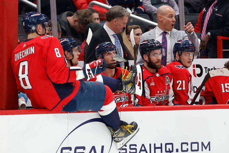 Apr 7, 2024; Washington, District of Columbia, USA; Washington Capitals head coach Spencer Carbery (R) gestures from behind the bench against the Ottawa Senators in the third period at Capital One Arena. Mandatory Credit: Geoff Burke-USA TODAY Sports