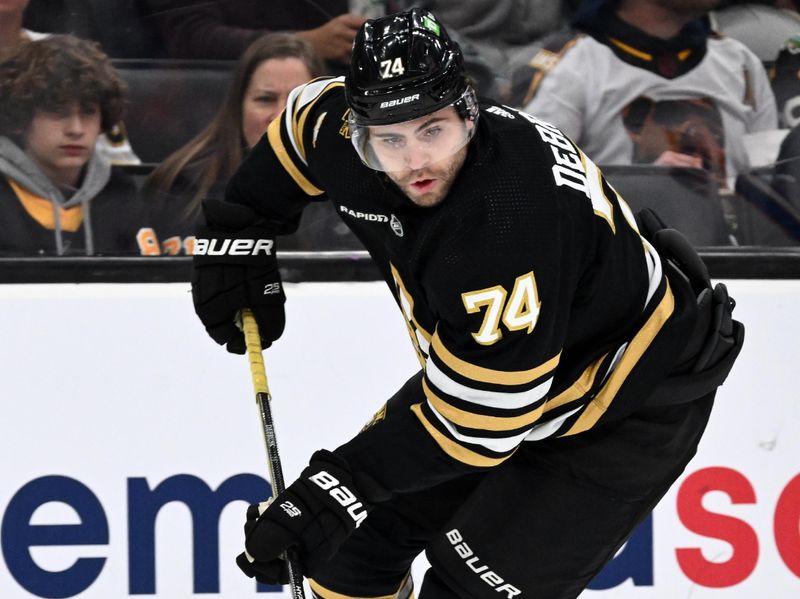 Nov 9, 2023; Boston, Massachusetts, USA; Boston Bruins left wing Jake DeBrusk (74) skates against the New York Islanders during the first period at the TD Garden. Mandatory Credit: Brian Fluharty-USA TODAY Sports