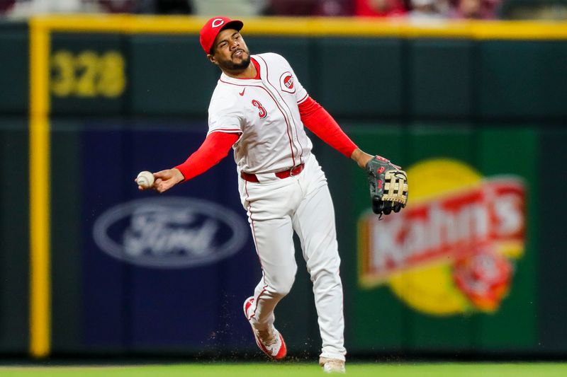 Apr 22, 2024; Cincinnati, Ohio, USA; Cincinnati Reds third baseman Jeimer Candelario (3) throws to first in attempt to get Philadelphia Phillies outfielder Nick Castellanos (not pictured) out in the ninth inning at Great American Ball Park. Mandatory Credit: Katie Stratman-USA TODAY Sports