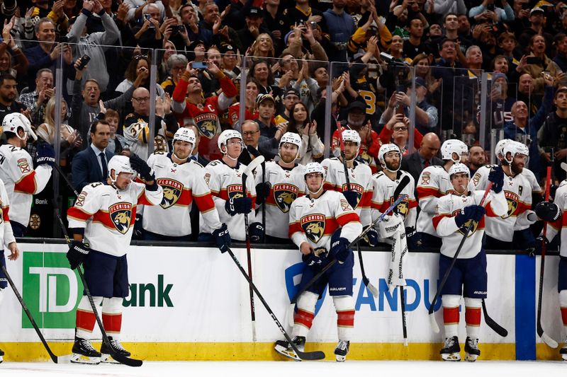 Oct 21, 2025; Boston, Massachusetts, USA; Florida Panthers left wing Brad Marchand (63), left, reacts to the applause from Boston fans after a tribute to him played during a timeout in the first period against the Boston Bruins at TD Garden. Mandatory Credit: Winslow Townson-Imagn Images